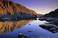 Sunset alpenglow reflection off a small tarn in Kings Canyon National Park
