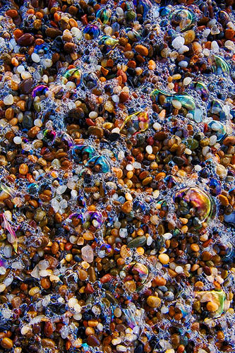 Pebbles, Sea Foam, and Rocks