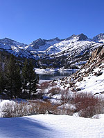 Snow covered hills and lake