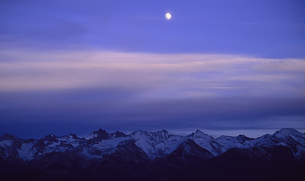 Moonrise at twilight over the snowy great western divide in Sequoia National Park, view from Moro Rock.
