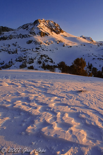 Sunset and snow at Winnemucca Lake in El Dorado National Forest
