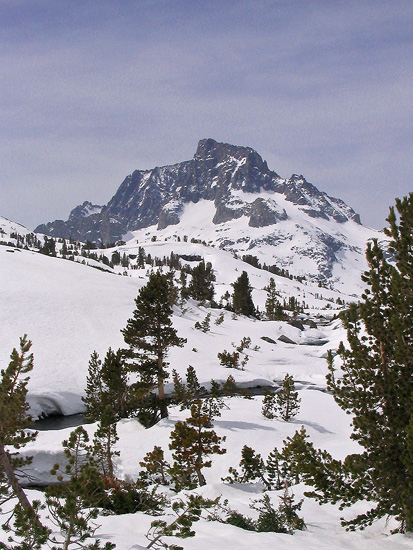 Snow, trees, and mountains in the high country of the Ansel Adams Wilderness