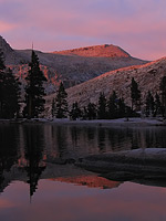 Setting sun glowing off the High Sierra, view from Pear Lake