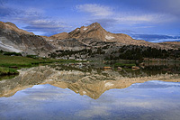 Cloudy Sunrise reflection at Greenstone Lake in the Sierra Nevada Mountains