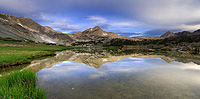 Cloudy Sunrise reflection at Greenstone Lake in the Sierra Nevada Mountains