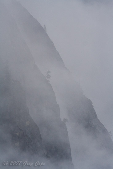 Telephoto close up of Dense fog on the granite walls of Yosemite Valley
